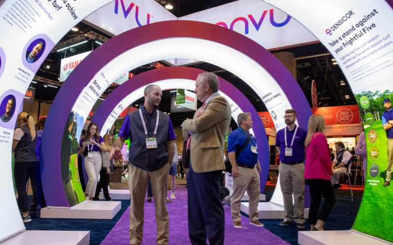 envu booth gcsaa tradeshow two men discussing