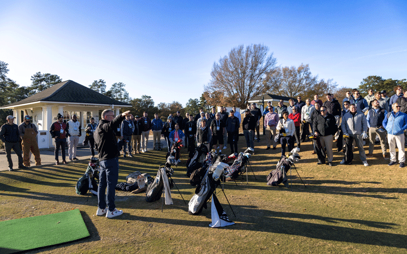 green start academy speaker addressing assistant superintendents on the golf course