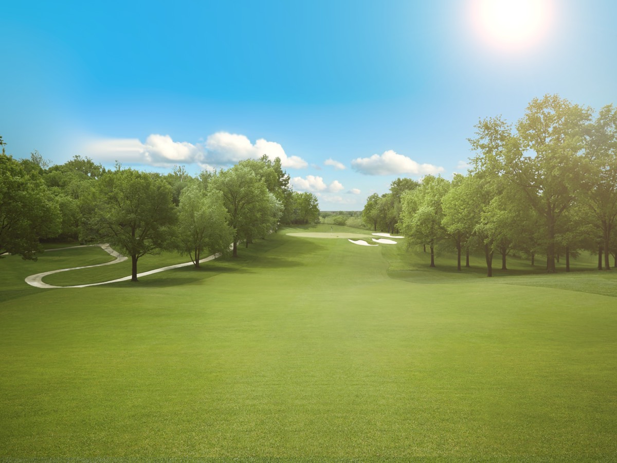sun shining over golf course