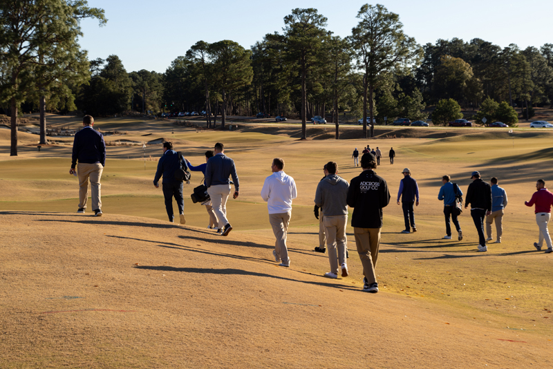 green start academy students walking across fairway