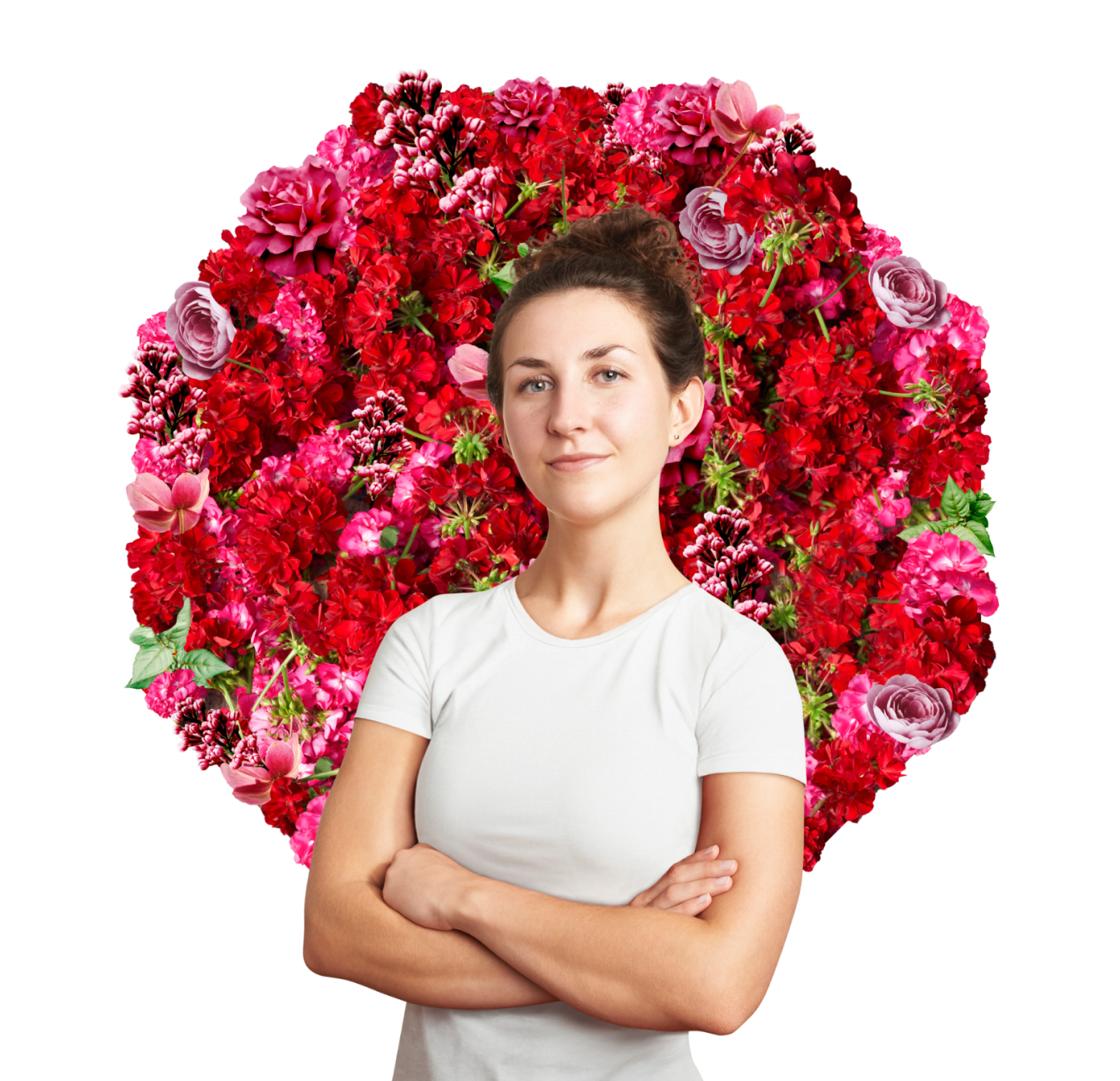 woman with arms crossed standing in front of pink and red flowers