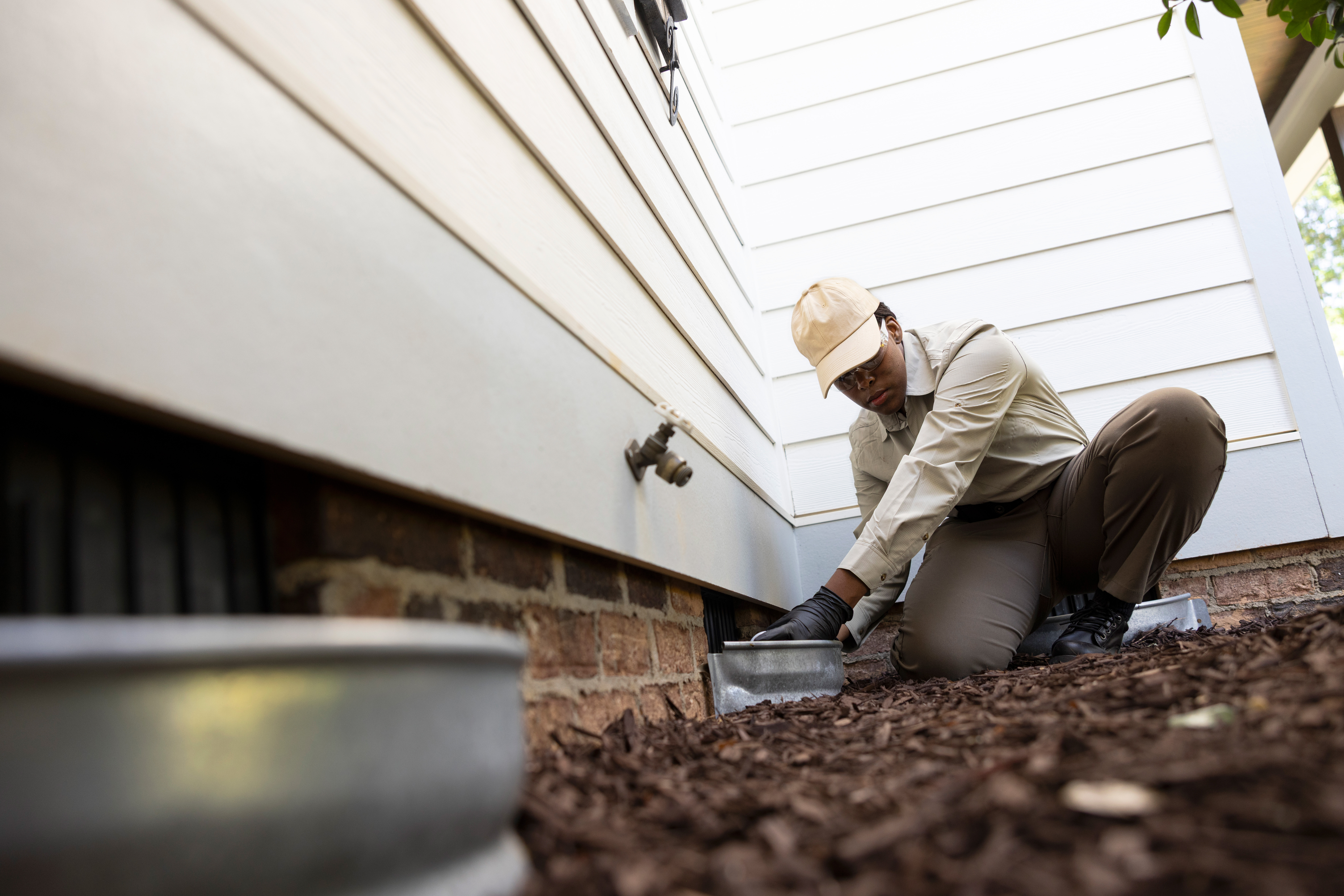 woman inspecting parameter of home