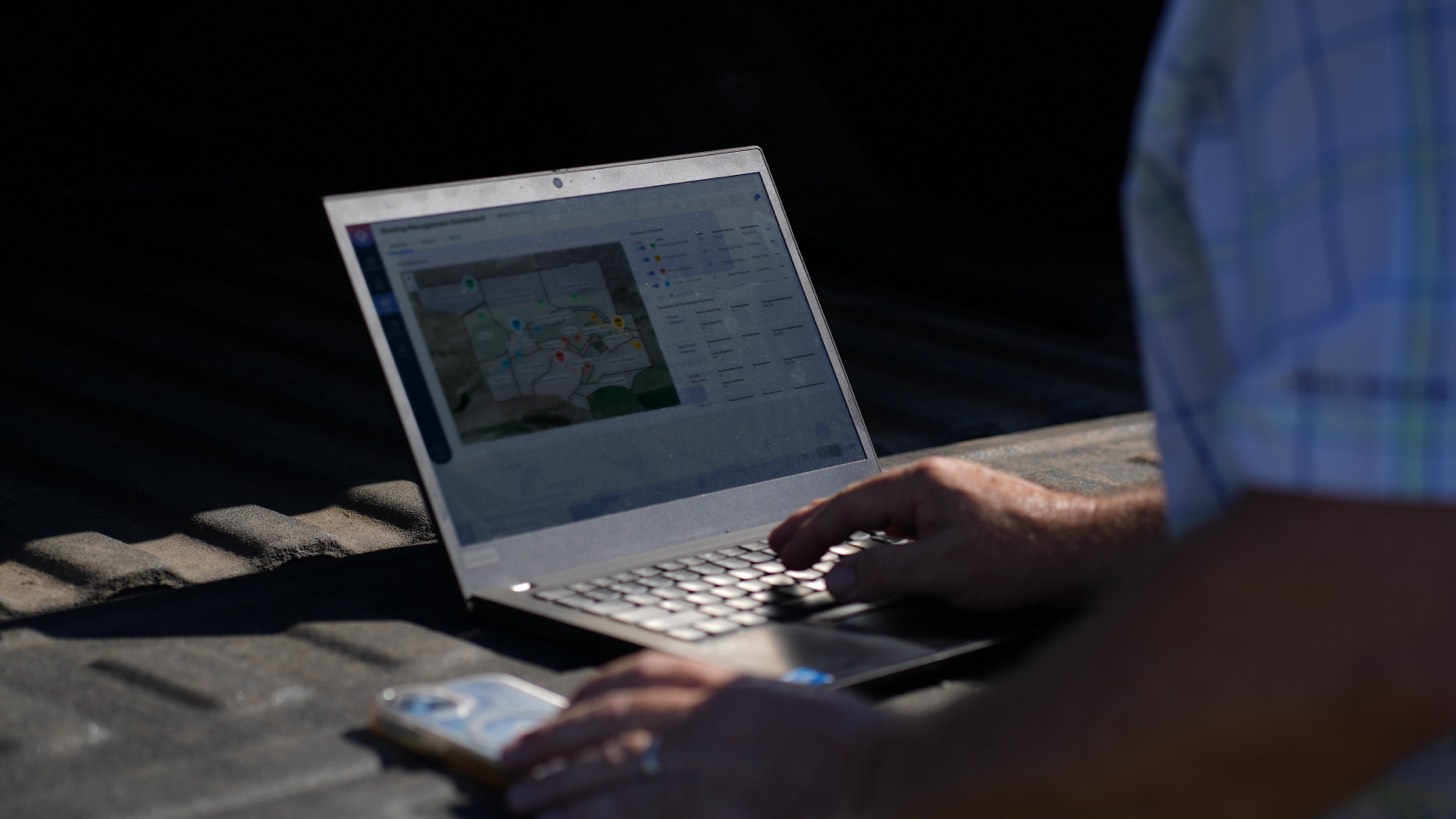 hand typing on laptop