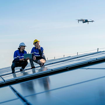 solar farm technicians flying drones