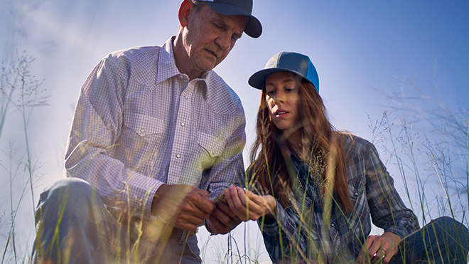 ranchers inspecting hay