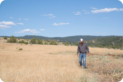 man standing in cheatgrass